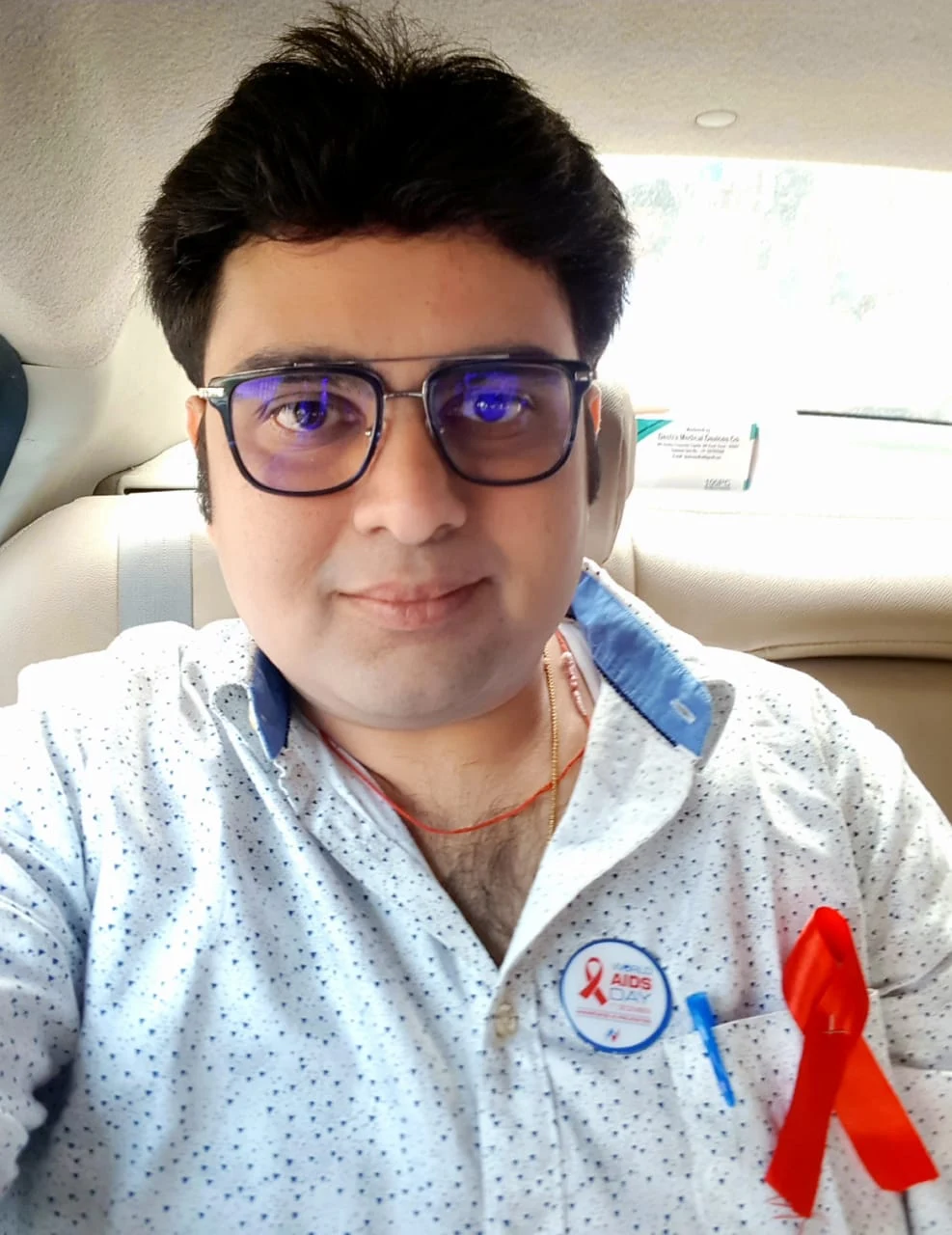 Dr. Ankit Singh wearing the red ribbon for World AIDS Day